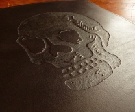 Custom skull design on black leather ring binder - Earthworks Journals